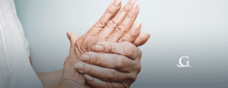 Woman Holding Hands In Pain Stock Photo