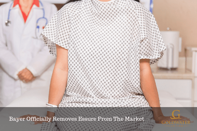 Female Patient Sitting On A Hospital Bed Stock Photo