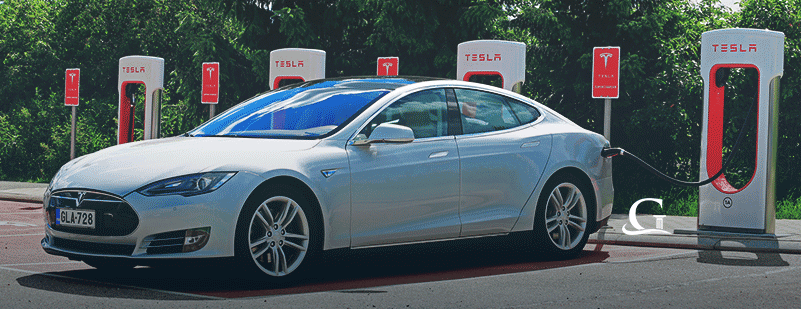 Tesla Being Recharged At Tesla Station Stock Photo
