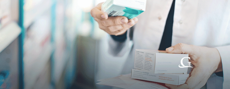 Doctor Holding Prescription Medications Stock Photo