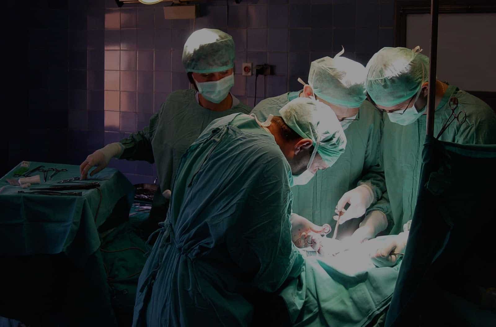 Multiple Doctors Performing Surgery Stock Photo