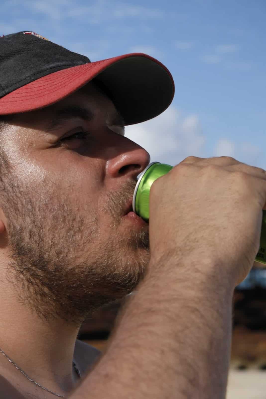 Young Man Drinking An Energy Drink Stock Photo