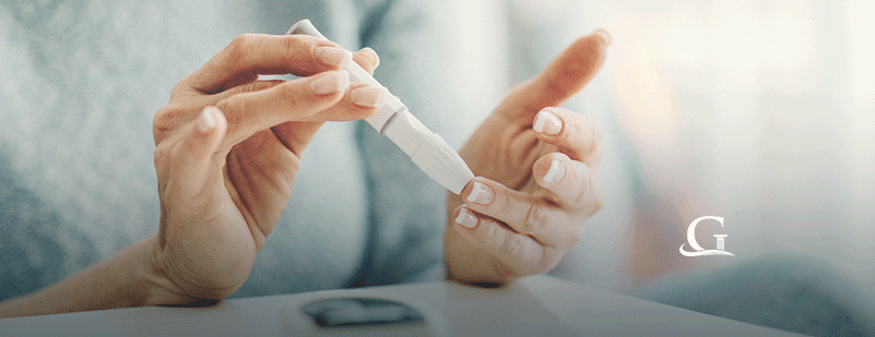 Woman Testing Blood Sugar Stock Photo