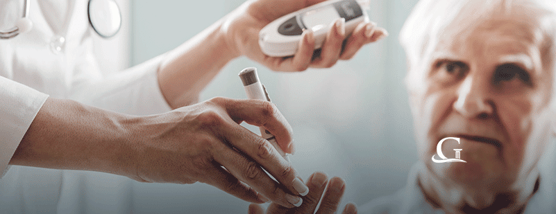 Elderly Man Being Addressed By Nurse Stock Photo