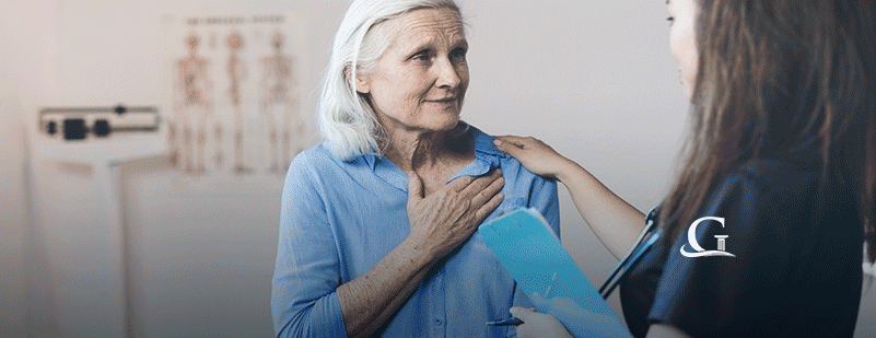 Elderly Woman Being Consoled By Nurse Stock Photo