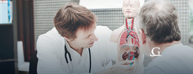 Surgeon Providing Demonstration To Patient Stock Photo