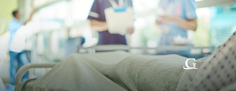 Patient In Hospital Bed Stock Photo