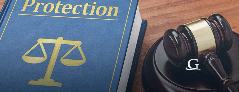 Protection Law Book With Gavel Stock Photo