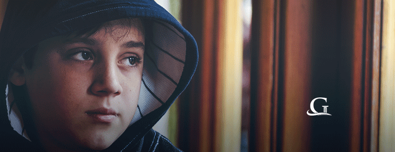 Young Boy With A Worried Look On His Face Stock Photo