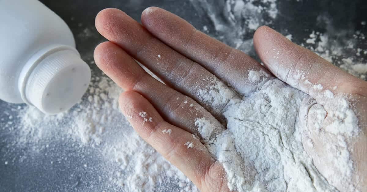 Spilled Talcum Powder Bottle Stock Photo