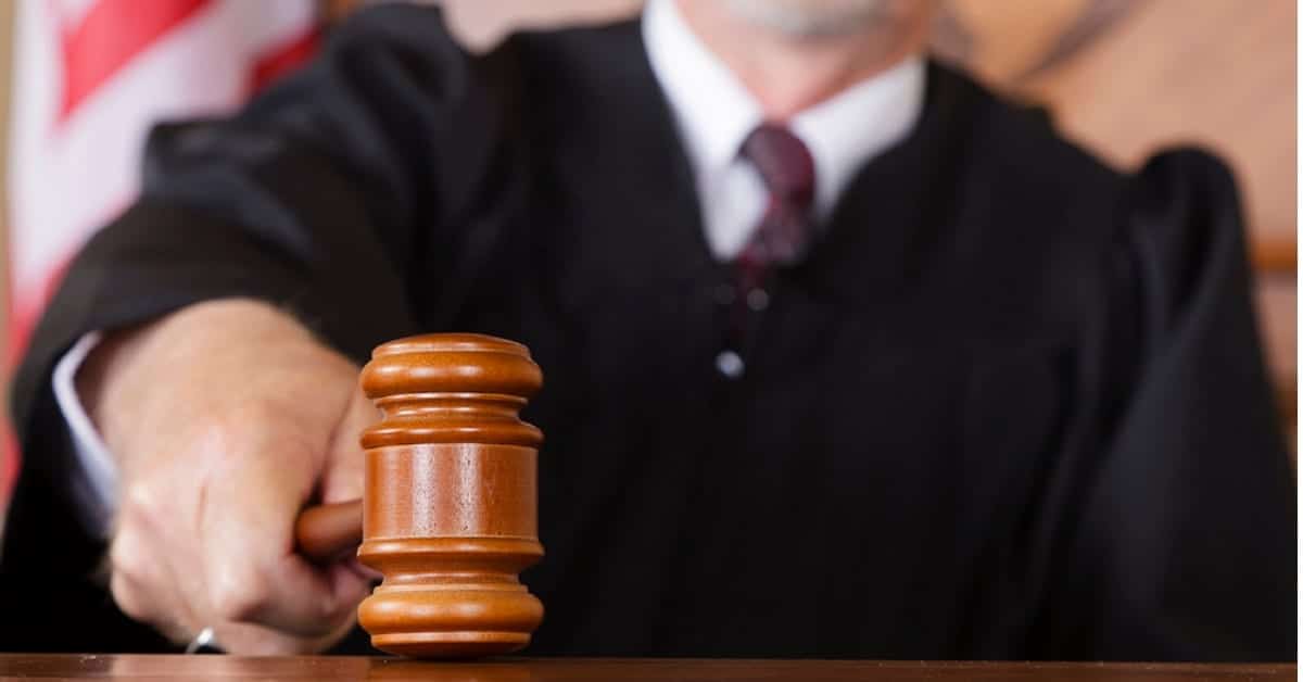Judge Slamming A Gavel Stock Photo
