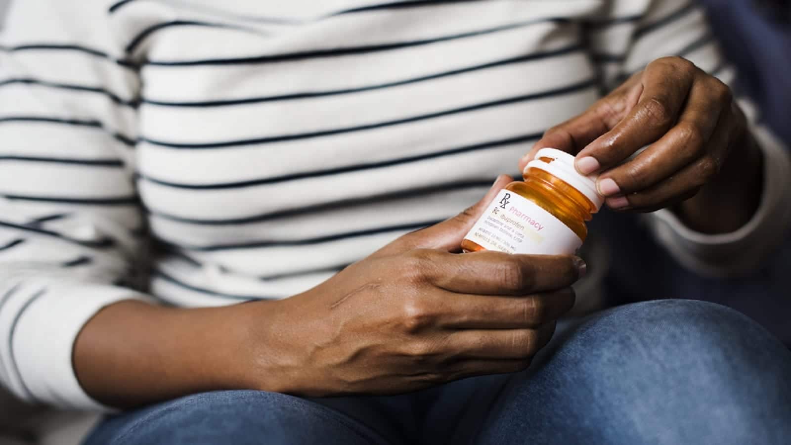 Woman Opening Prescription Medication Bottle Stock Photo