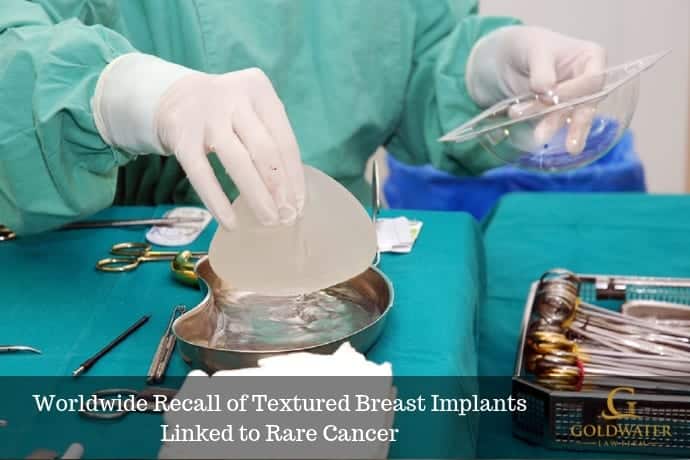 Surgeon Working At Surgery Table With Breast Implants