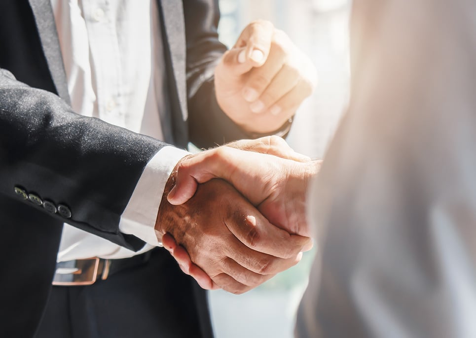 personal injury attorney shaking hands with a client