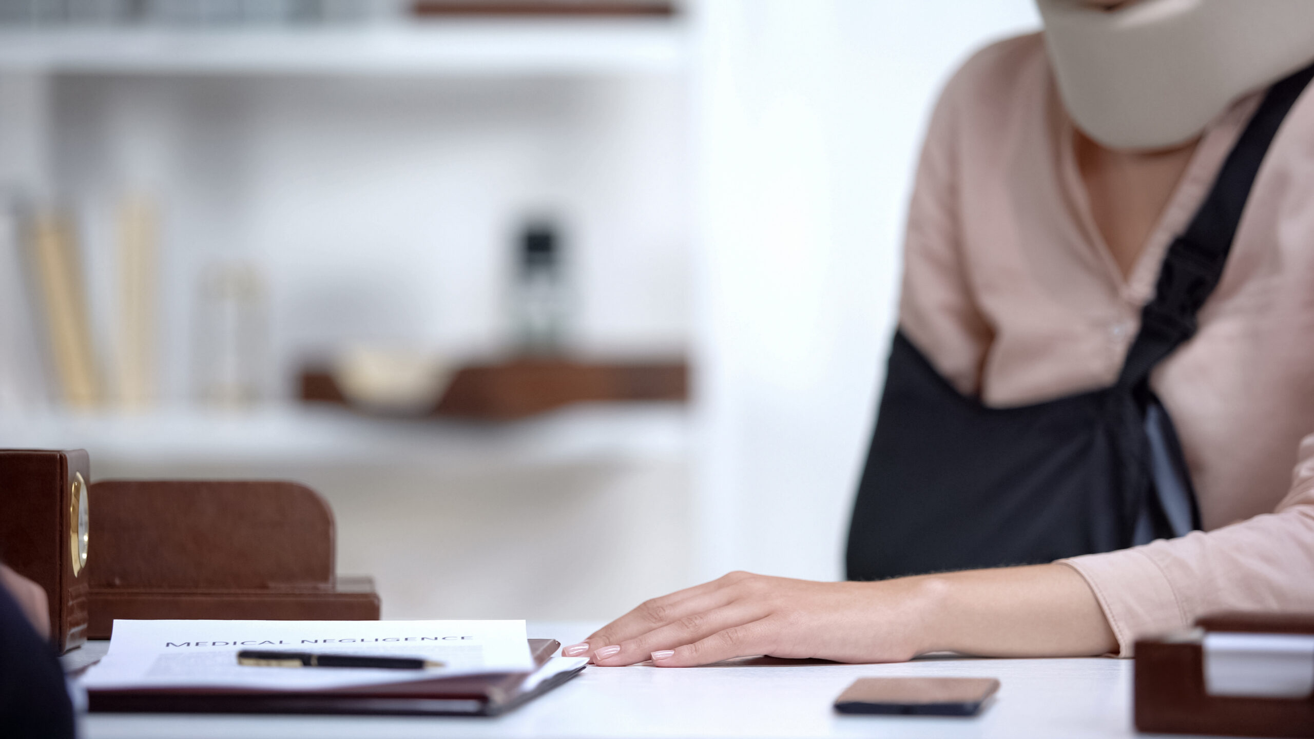 a woman hiring a personal injury lawyer after a Phoenix, AZ, accident